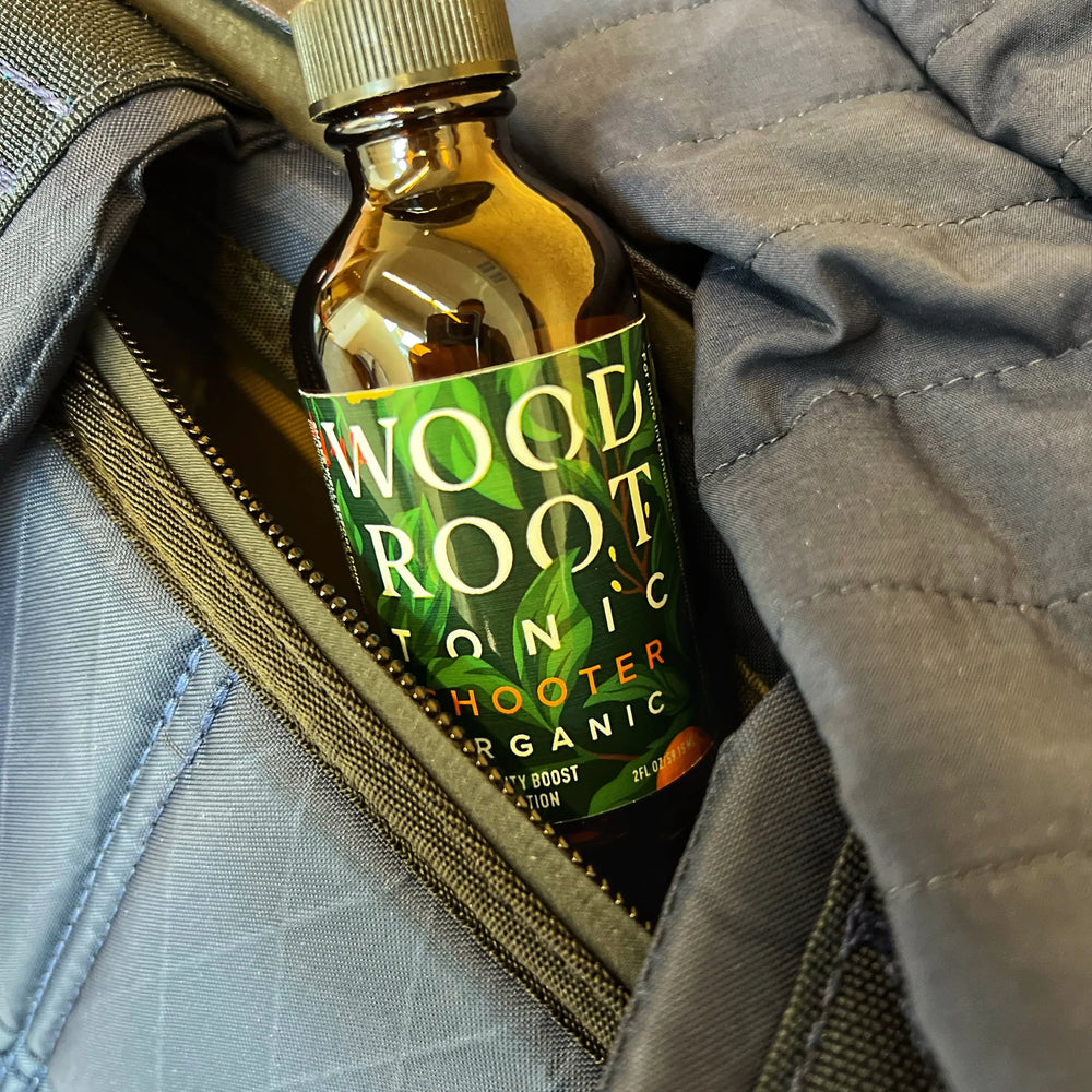 
                  
                    Woodroot Tonic shooter sticking out of a bag as its taken on the go.
                  
                