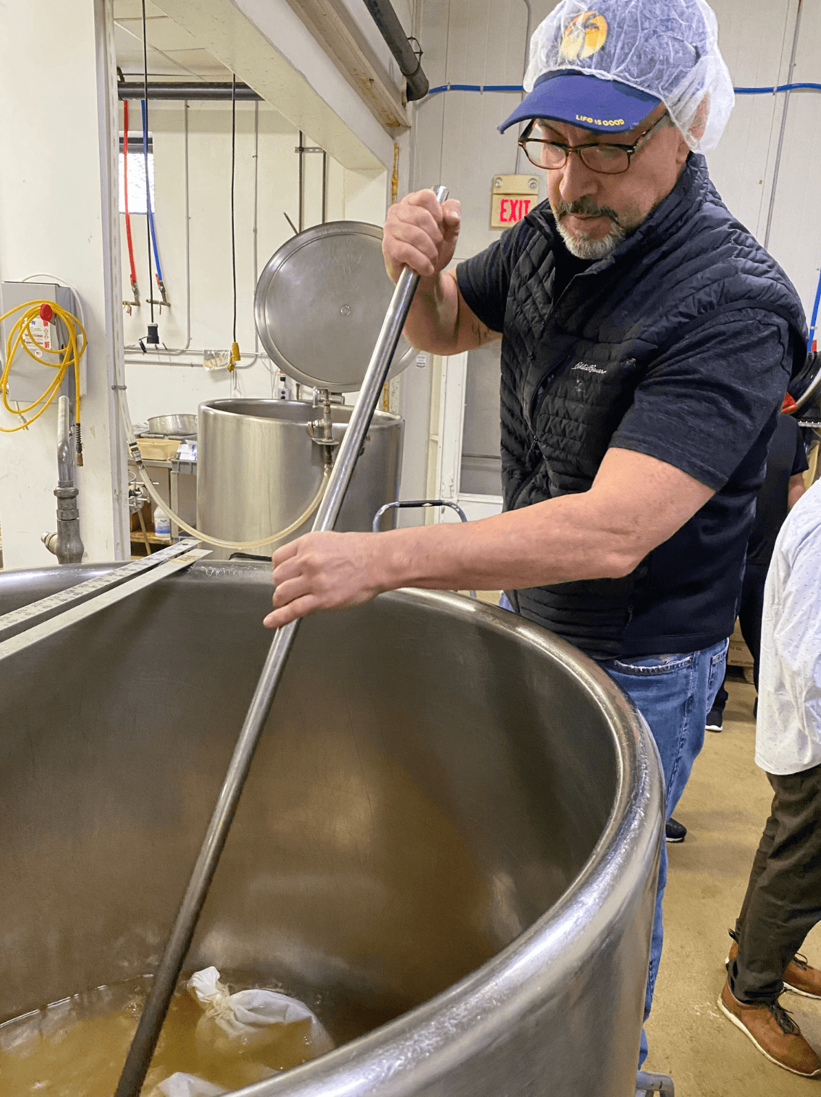 Founder of Morningside Naturals, Jeff Bertone, mixing Woodroot Tonic in the factory.