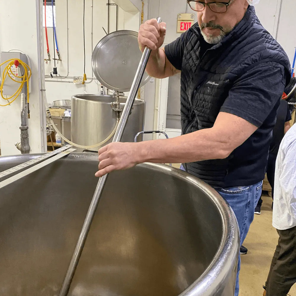 Founder of Morningside Naturals, Jeff Bertone, mixing Woodroot Tonic in the factory. 