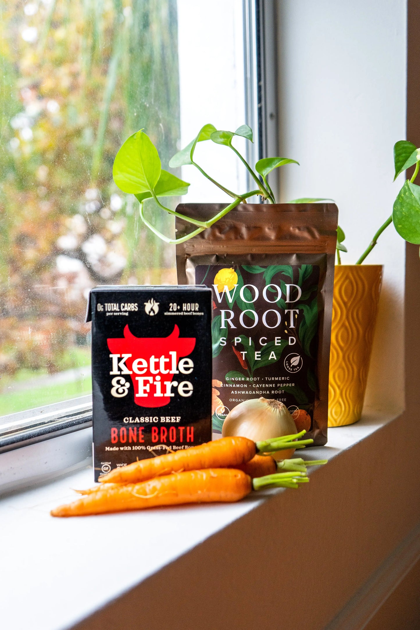 Woodroot Spiced tea photographed next to Kettle & Fire Bone Broth to make a delicious healthy snack. 