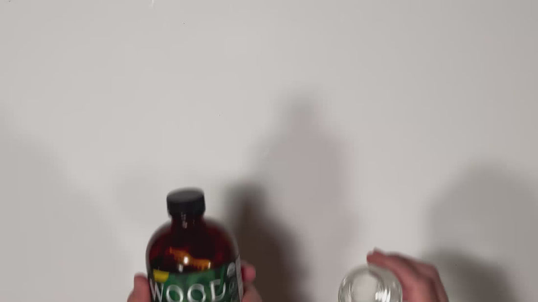 Video of hand pouring Woodroot Tonic into a shot glass, part of a gut healthy daily ritual. 